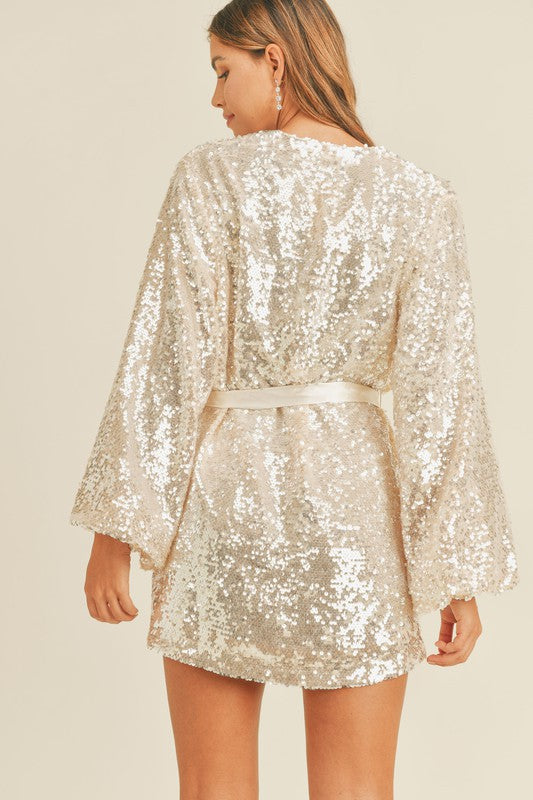 sparkly cream dress ASTR the Label | Liese Sequin Bustier Midi in Long sleeves feature flared cuffs with slits Creamy Sparkle Dress Teuta Matoshi